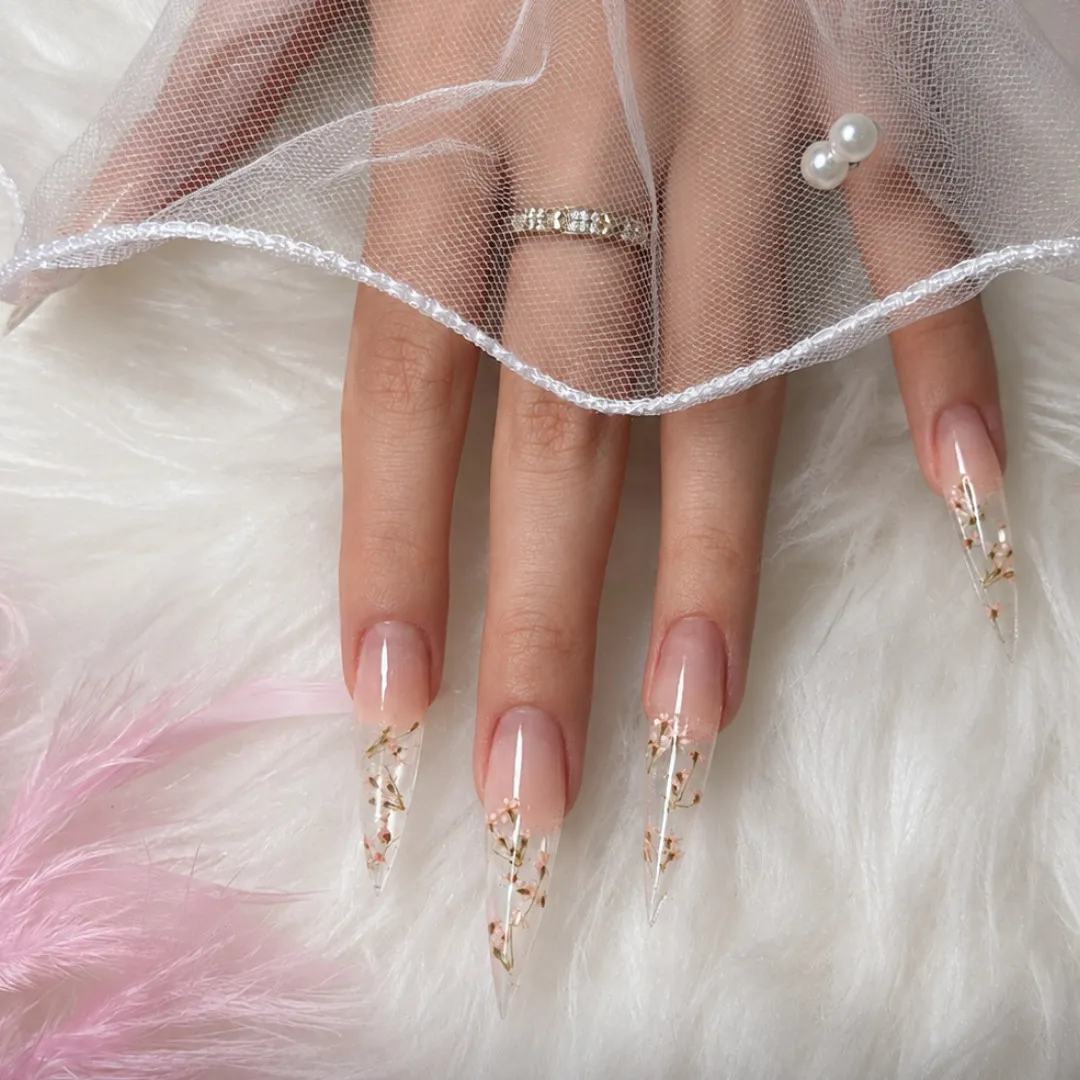 Stiletto nail extensions with embedded dried flowers